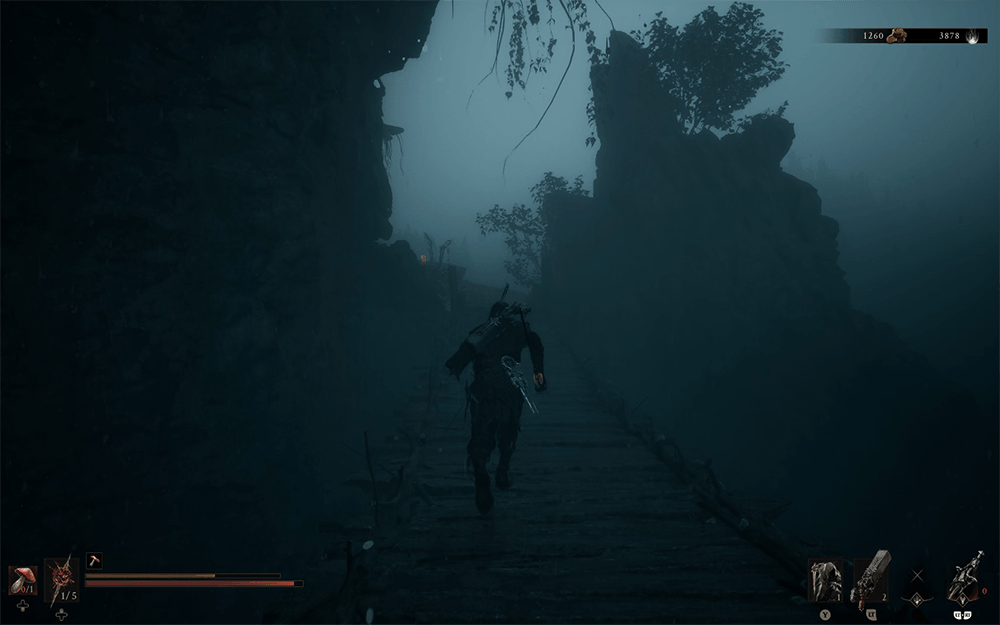 Mortal Shell II gameplay screenshot showing the hero running through a foggy stone pathway between cliffs