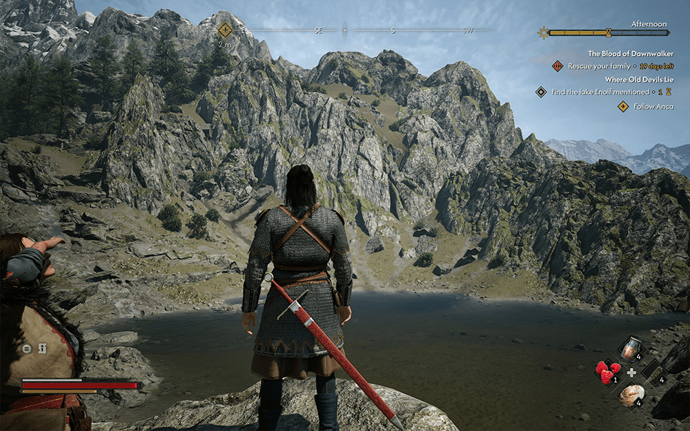 The Blood of Dawnwalker gameplay screenshot showing Coen in chainmail armor overlooking a rocky lake during the afternoon